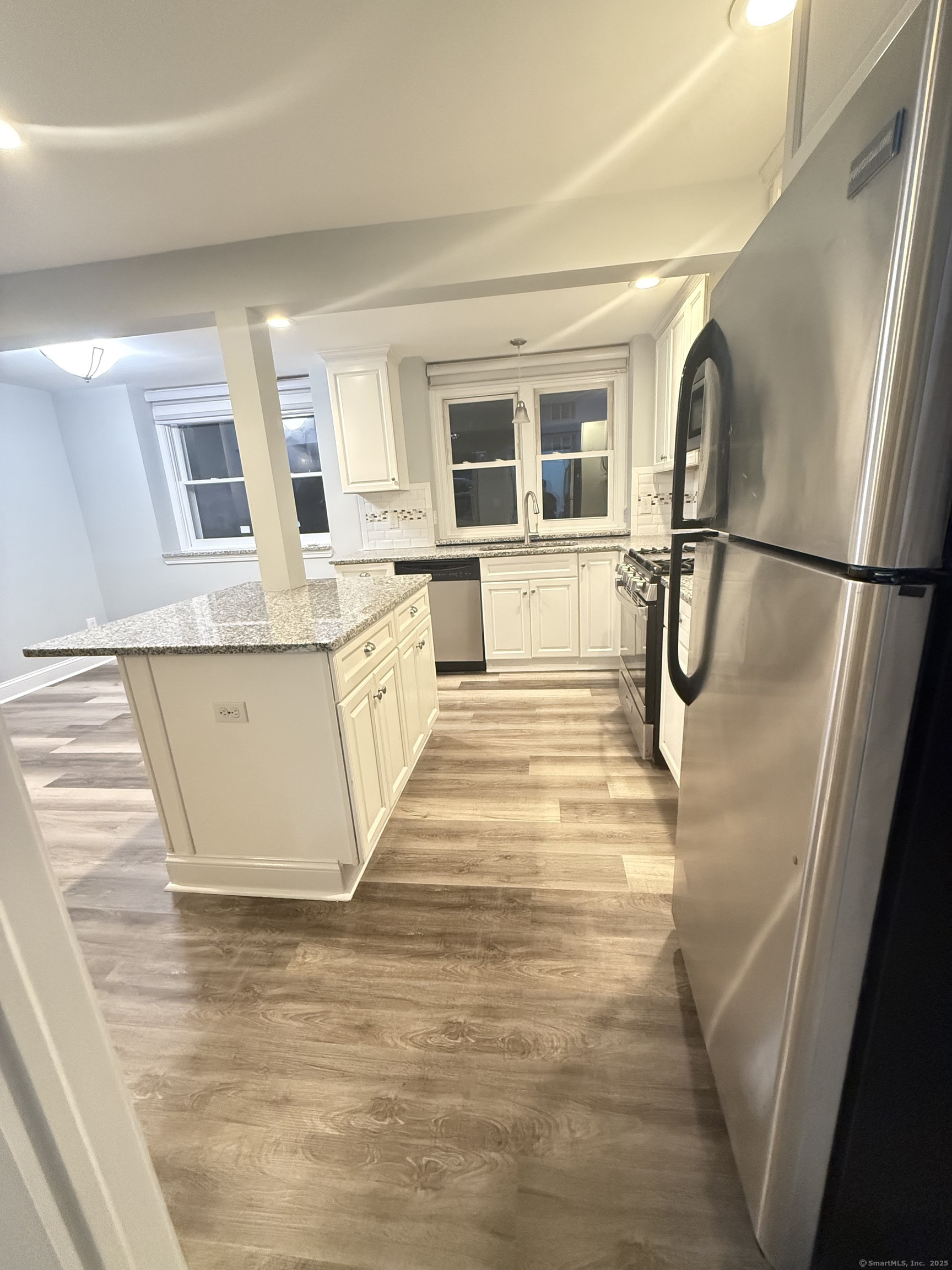 65 Muir Terrace, Unit 1 Southington, CT 06489 - Photo 9 of 24 a view of a kitchen with a sink