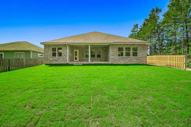 a picture of a room with furniture and a window