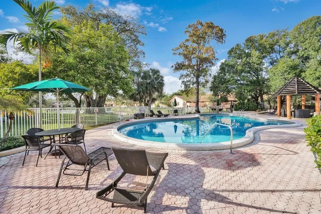 a view of a swimming pool with a patio