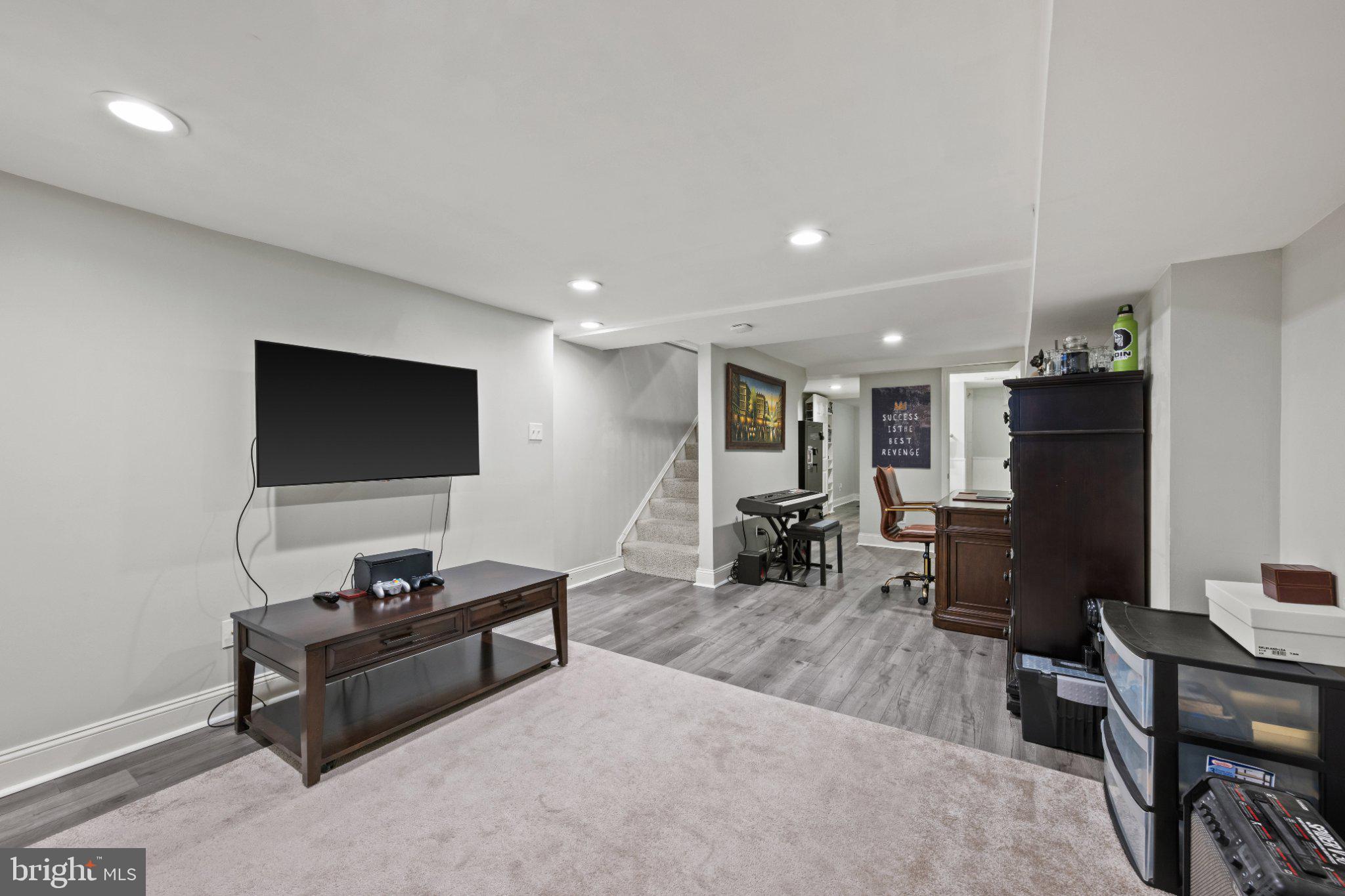 615 South Clinton Street Baltimore, MD 21224 - Photo 12 of 39 a living room with furniture and a flat screen tv