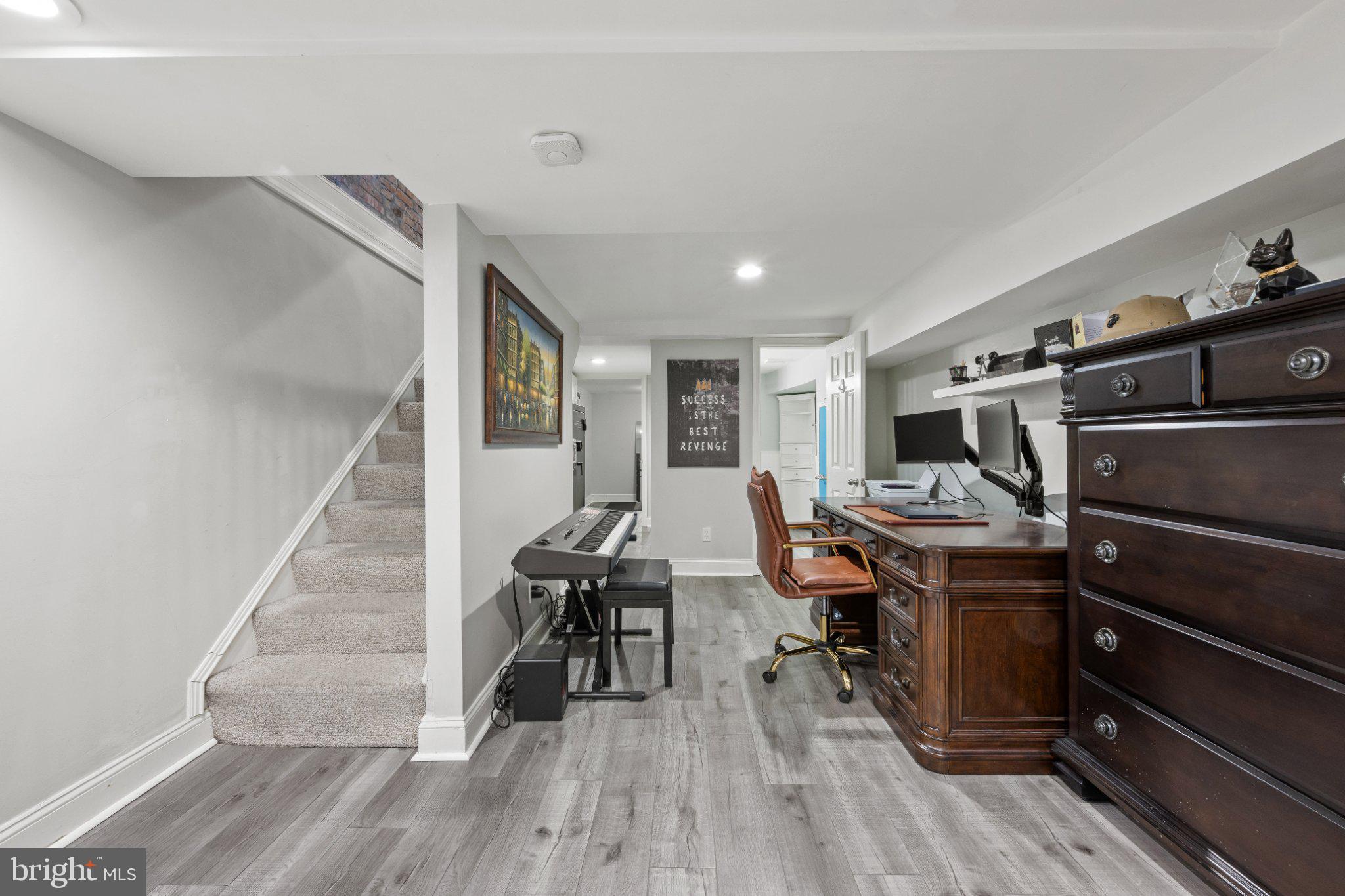 615 South Clinton Street Baltimore, MD 21224 - Photo 14 of 39 a view of a workspace with furniture and wooden floor
