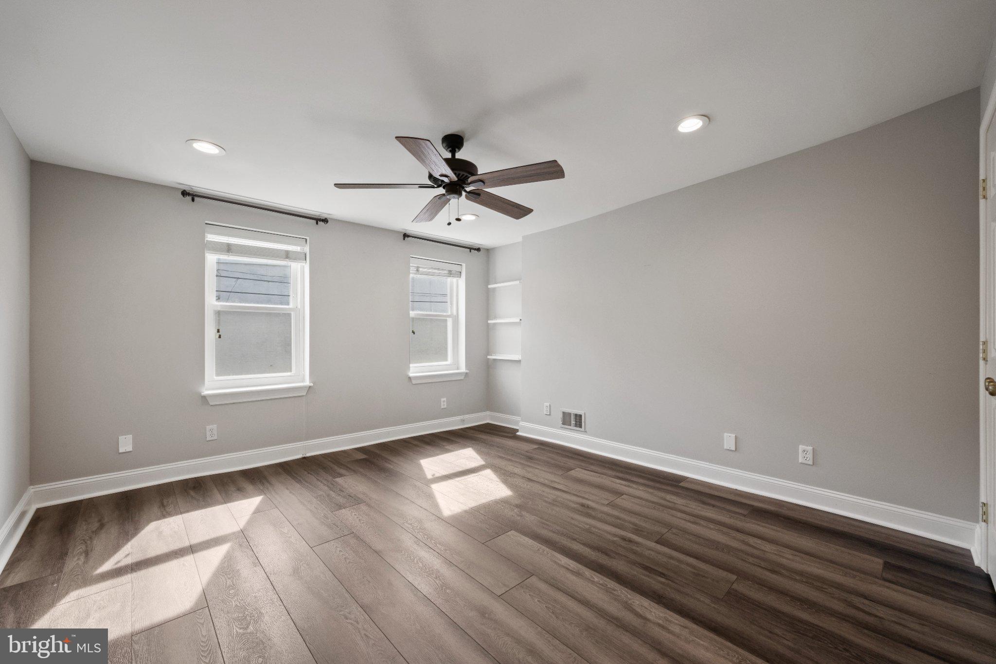 615 South Clinton Street Baltimore, MD 21224 - Photo 20 of 39 a view of wooden floor and a chandelier fan in a room