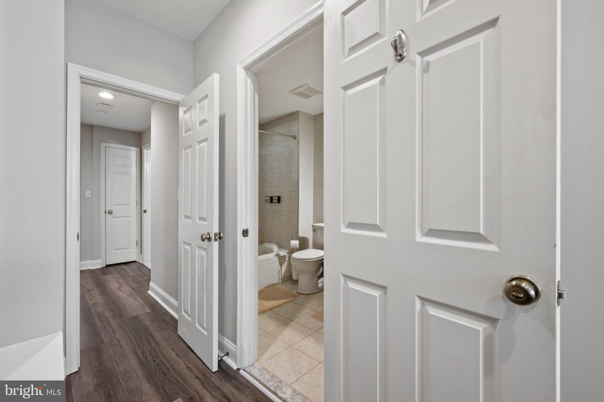 615 South Clinton Street Baltimore, MD 21224 - Photo 30 of 39 a view of a bathroom with a glass door and shower