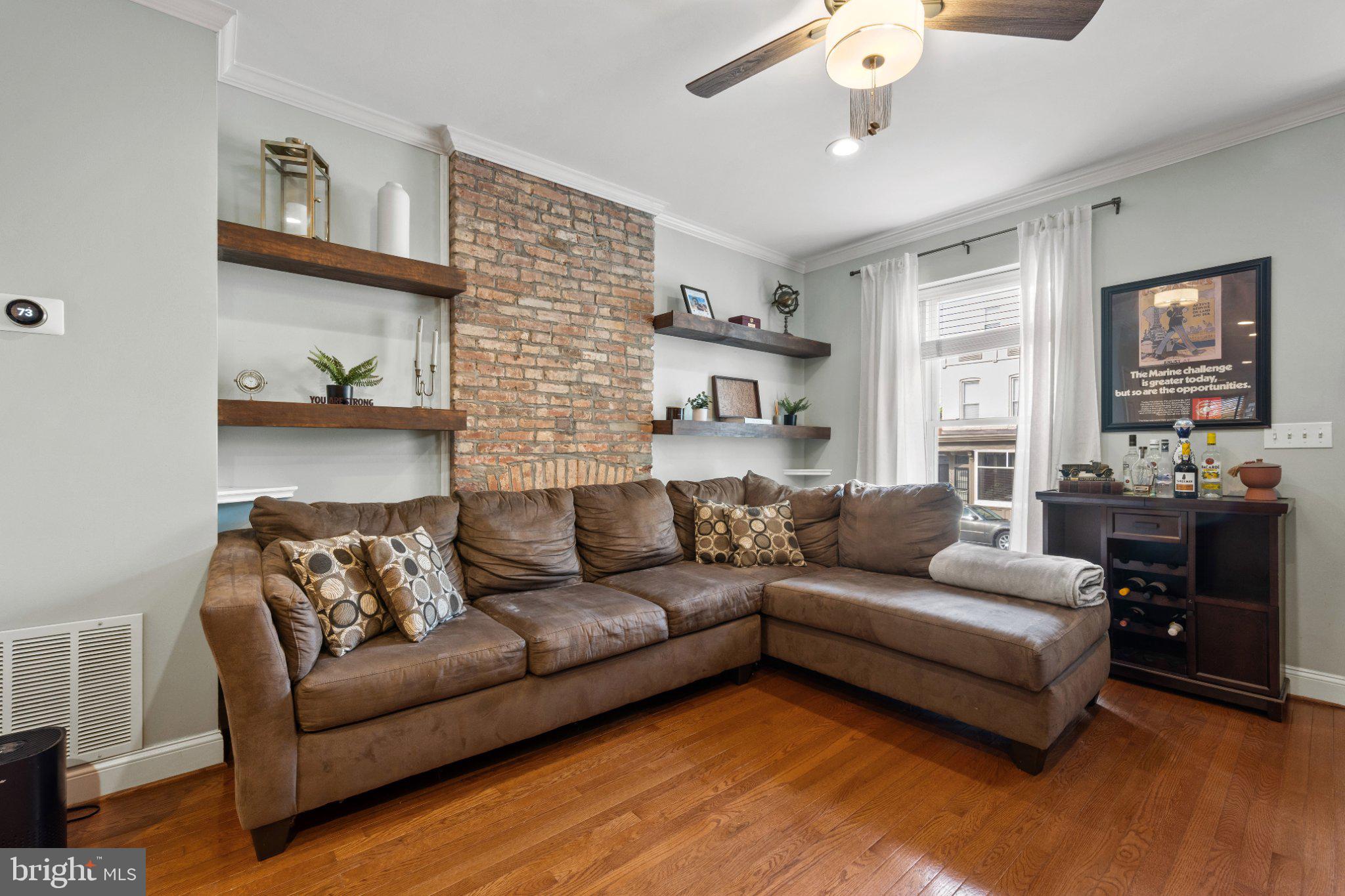 615 South Clinton Street Baltimore, MD 21224 - Photo 3 of 39 a living room with furniture and a flat screen tv