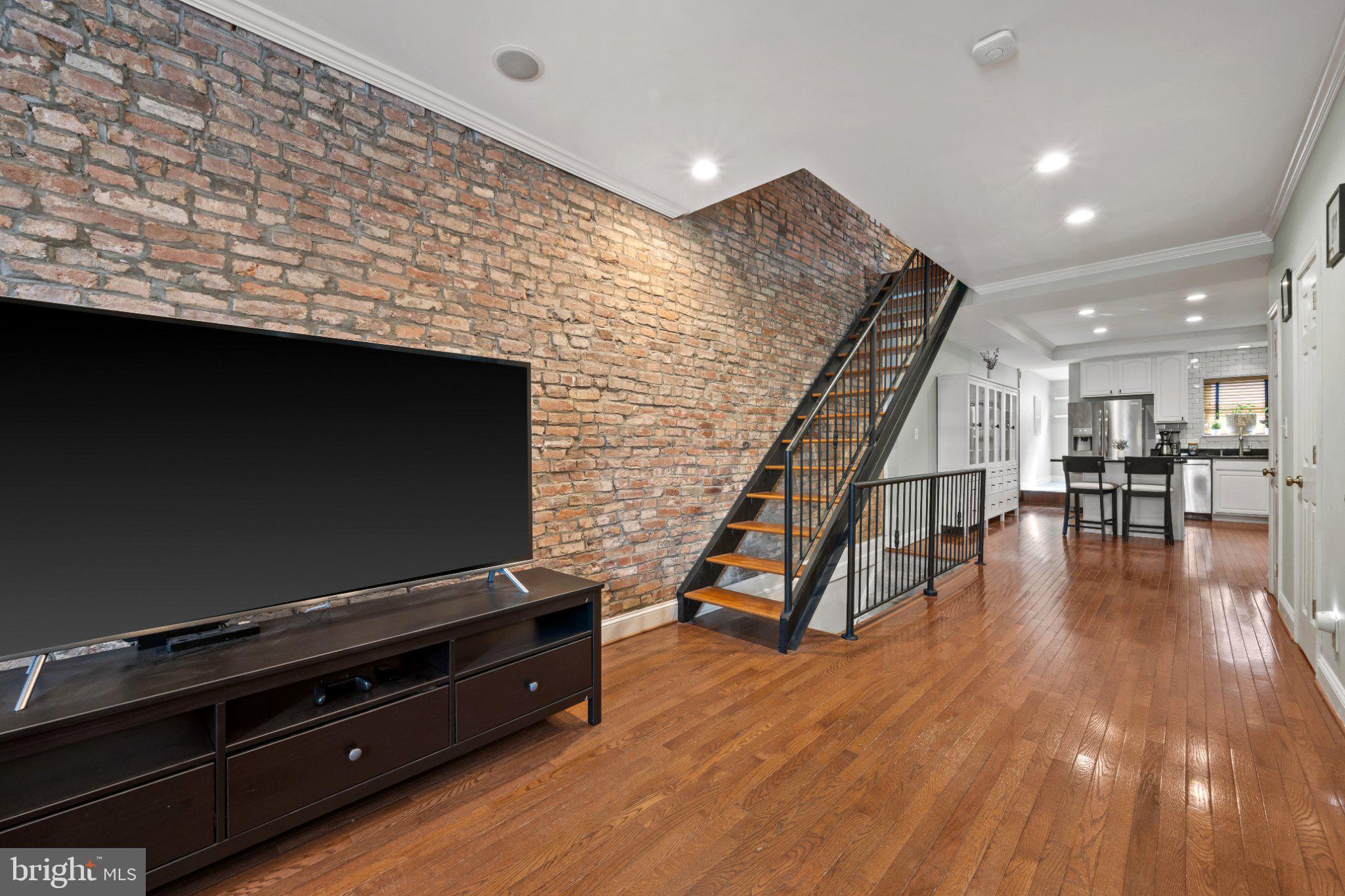 615 South Clinton Street Baltimore, MD 21224 - Photo 4 of 39 a living room with furniture and a flat screen tv