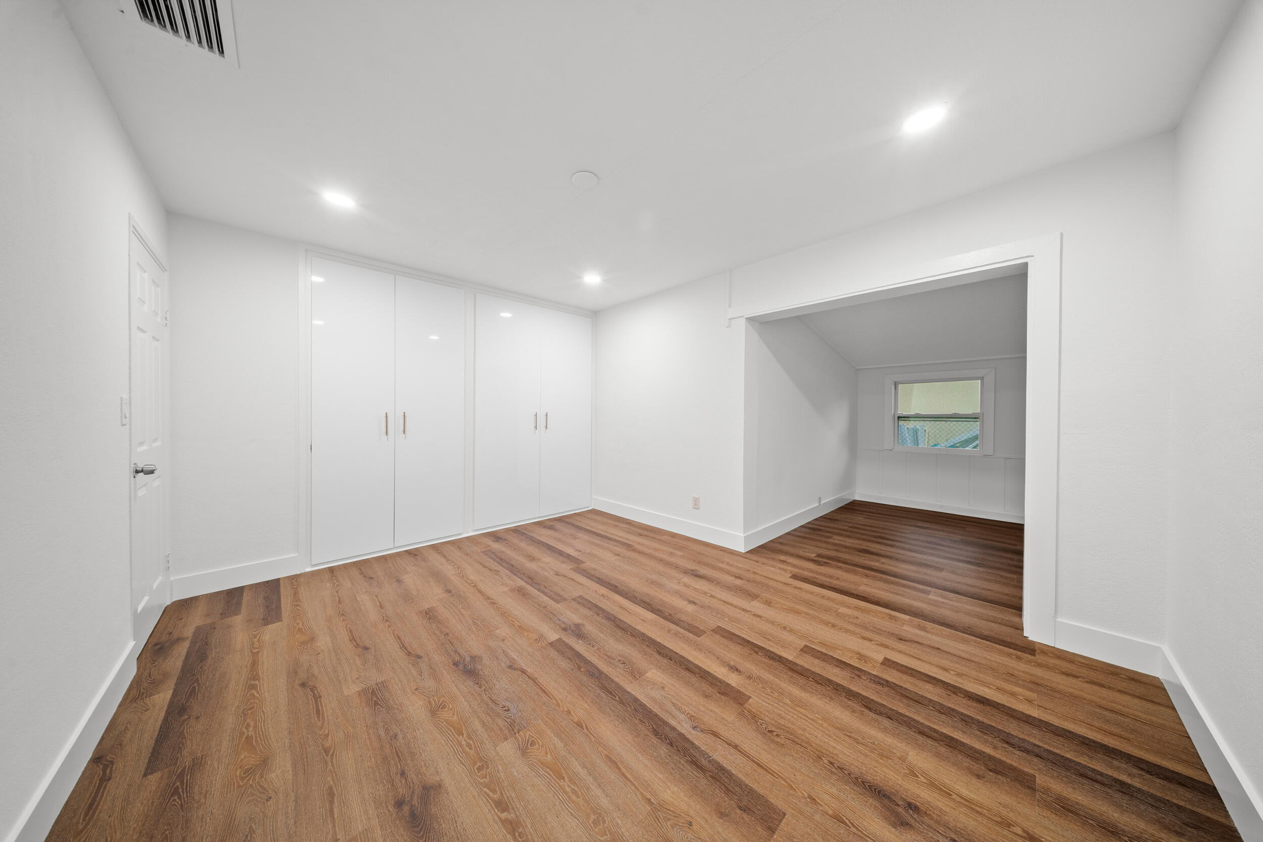 2904 Southeast Bamboo Street Stuart, FL 34997 - Photo 21 of 51 a view of empty room with wooden floor