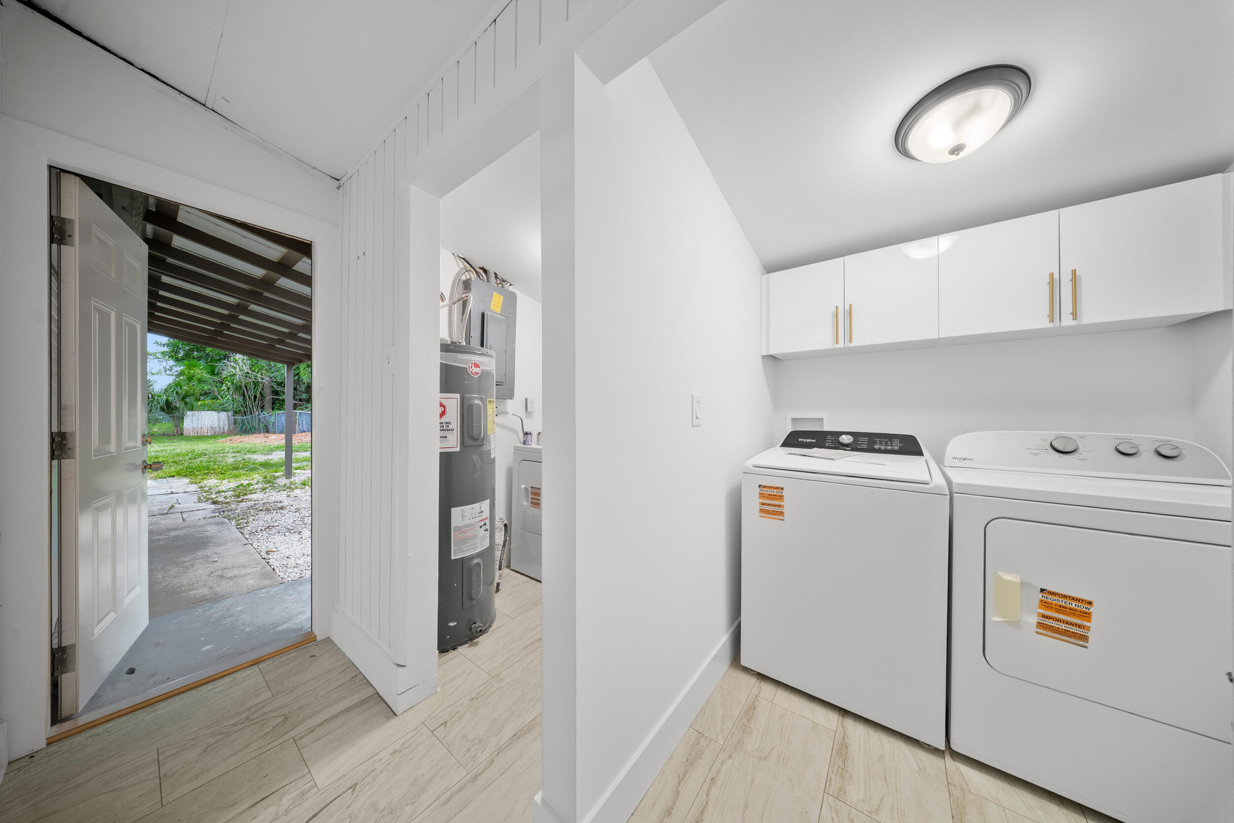 2904 Southeast Bamboo Street Stuart, FL 34997 - Photo 26 of 51 a utility room with dryer and washer