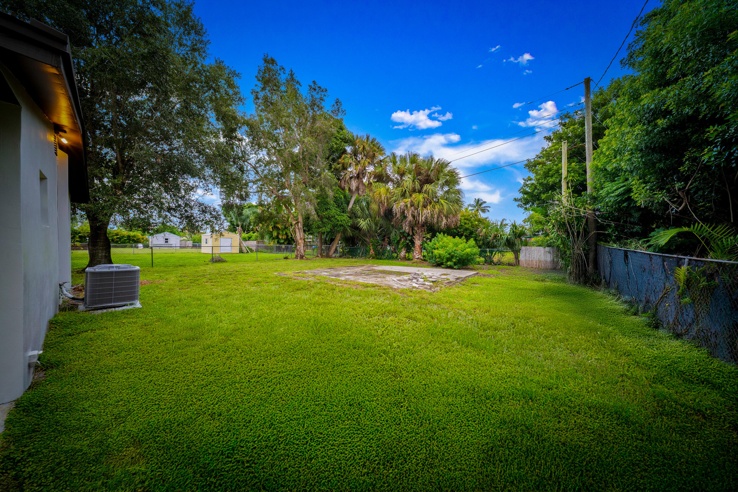 2904 Southeast Bamboo Street Stuart, FL 34997 - Photo 45 of 51 a view of green field with trees in the background