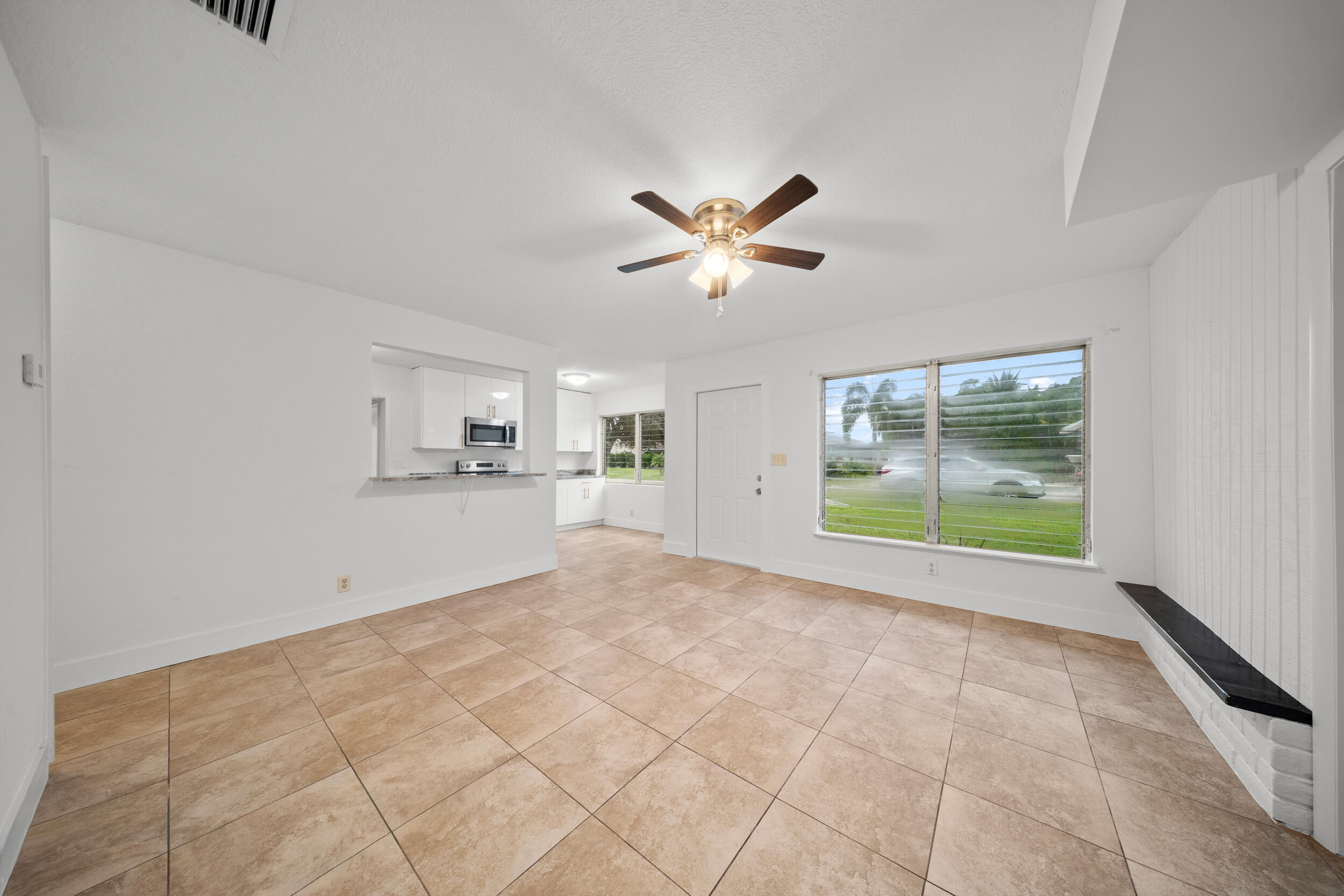 2904 Southeast Bamboo Street Stuart, FL 34997 - Photo 8 of 51 a view of an empty room with a window