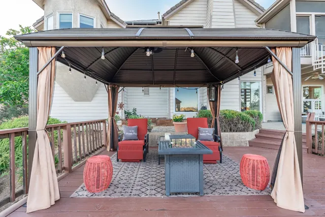 a view of roof deck with furniture
