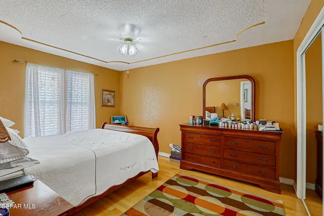 a bedroom with furniture and a chandelier