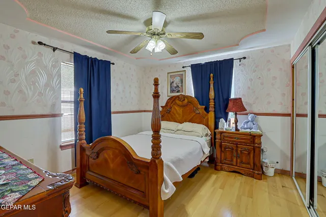 a bedroom with a bed and a dresser