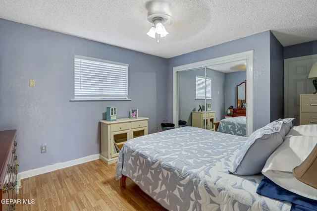 a bathroom with a sink a toilet and shower curtain