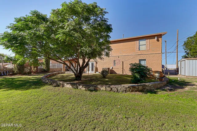 a front view of a house with a road