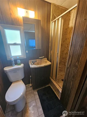 a dining room with furniture and a mirror