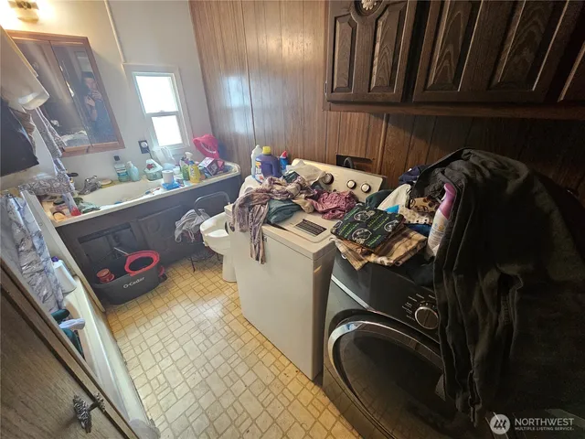 a view of a backyard with wooden fence