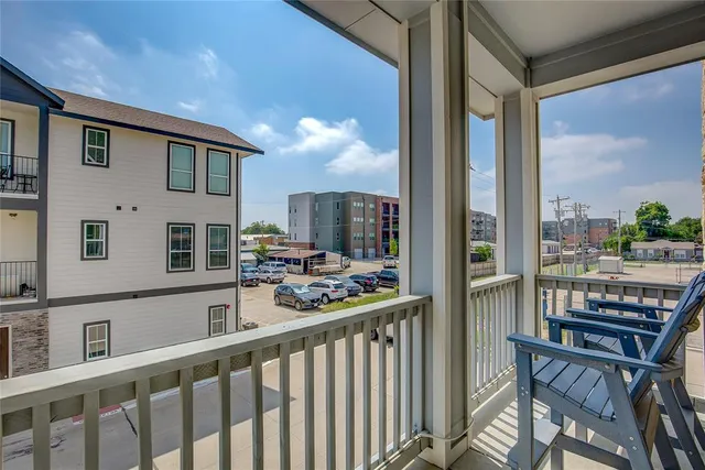 a view of a balcony with chairs