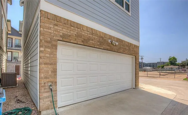 a view of a door and brick wall