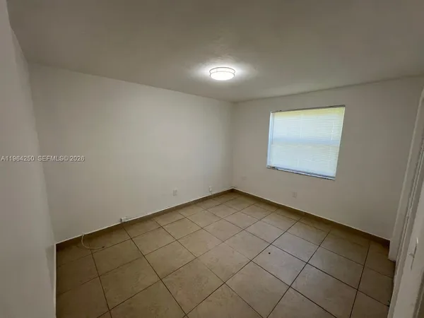 an empty room with a bench