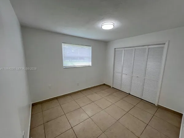 a view of an empty room and window