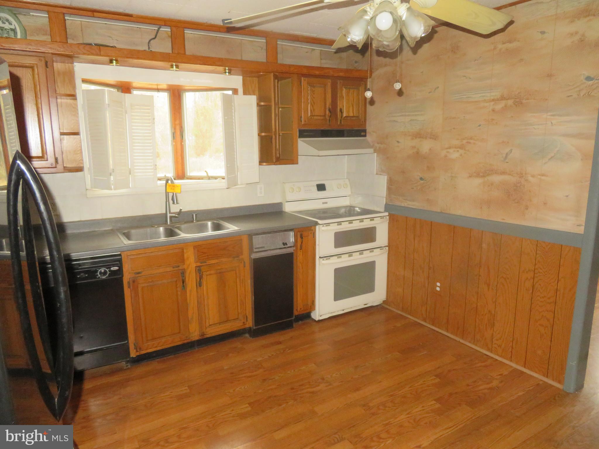 721 Lucas Lane Southampton, NJ 08088 - Photo 11 of 19 a kitchen with stainless steel appliances granite countertop a sink stove and refrigerator