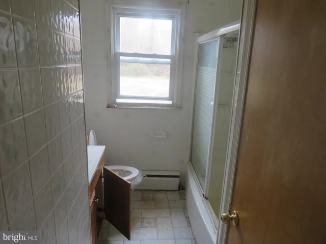 a bathroom with a sink and toilet