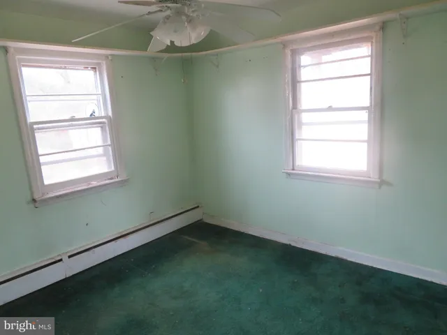 a view of a room that has a window in it