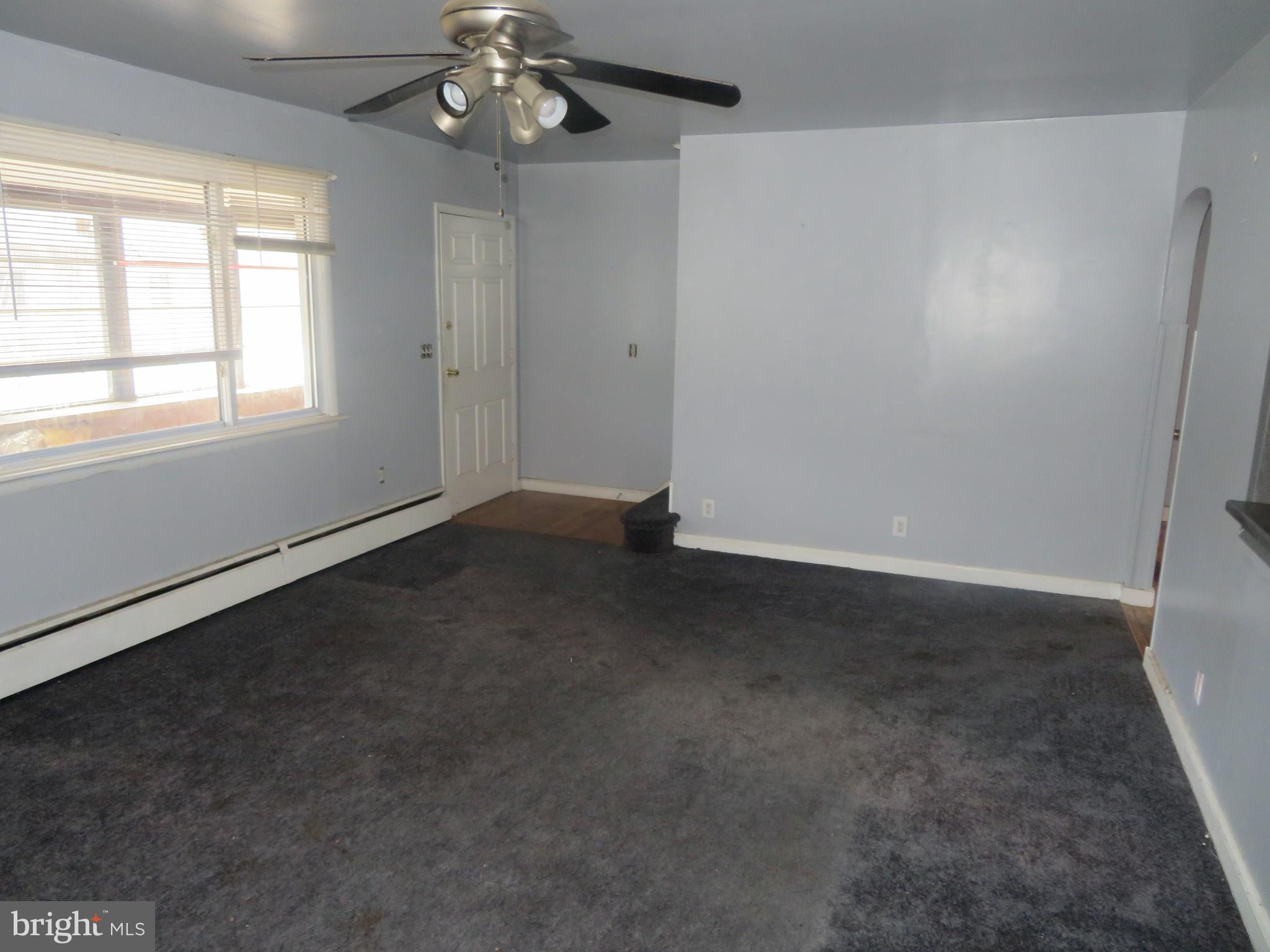 721 Lucas Lane Southampton, NJ 08088 - Photo 8 of 19 en empty room with windows and chandelier fan