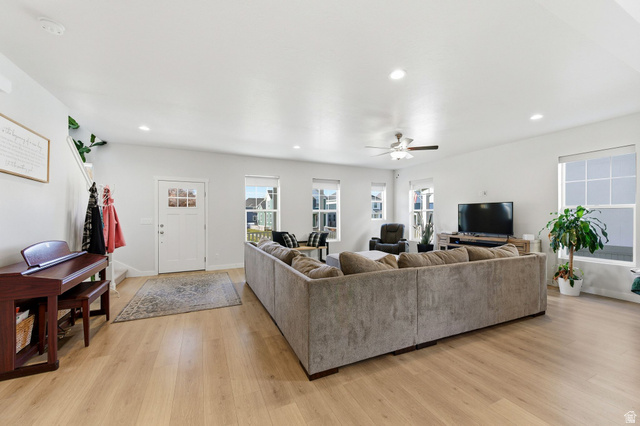 1038 South Old Towne Road Layton, UT 84041 - Photo 10 of 39 Spacious living area featuring light wood-finish flooring, recessed lighting, and multiple windows