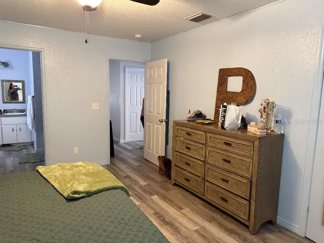 a bathroom with a sink a toilet and a shower curtain