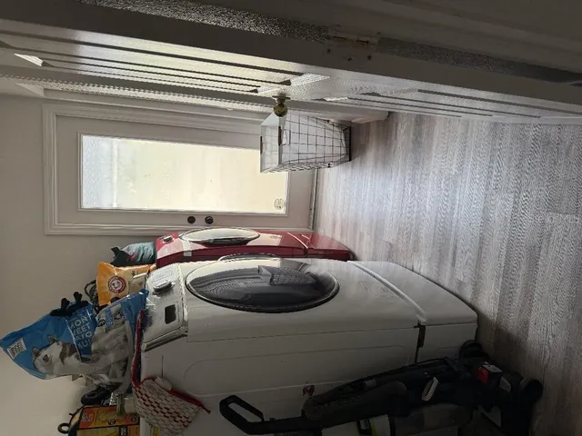a view of living room with furniture and a window
