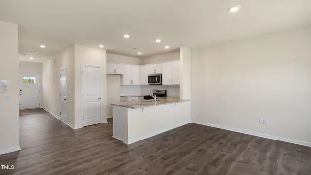 a view of kitchen with wooden floor