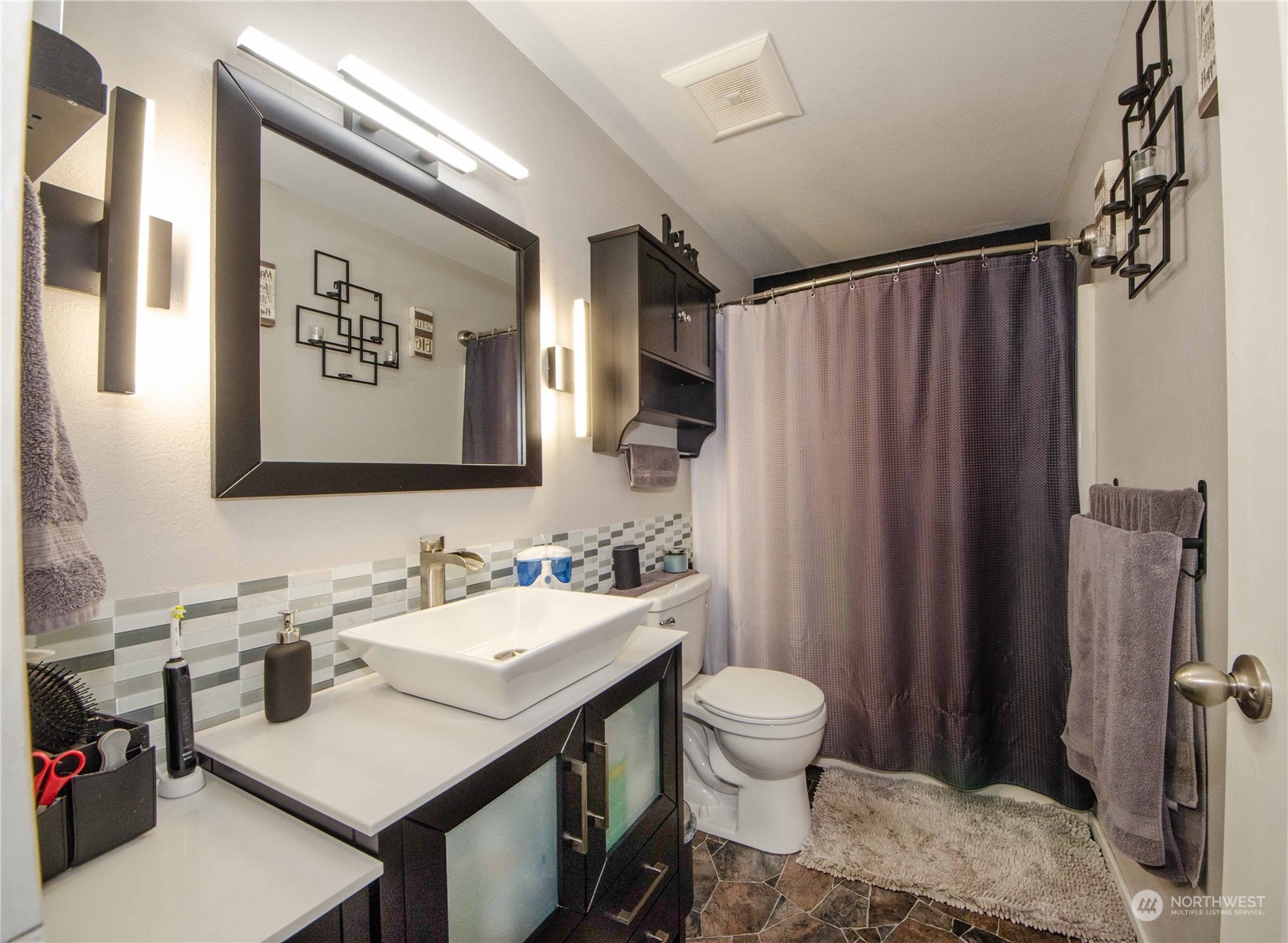 18425 Apricot Street Southwest Rochester, WA 98579 - Photo 11 of 39 a bathroom with a sink toilet and shower