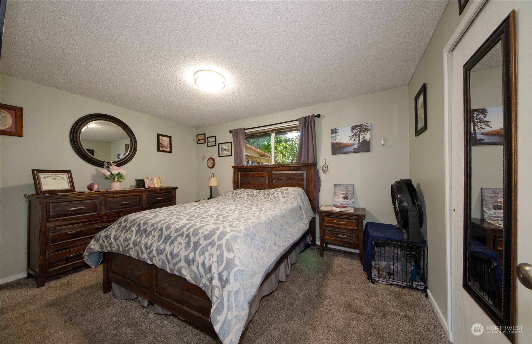 18425 Apricot Street Southwest Rochester, WA 98579 - Photo 13 of 39 a bedroom with a bed a desk and chair