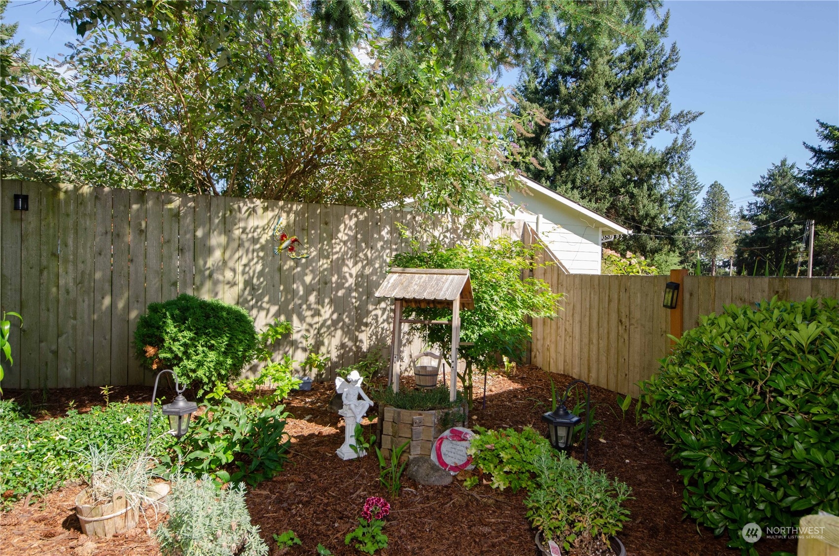 18425 Apricot Street Southwest Rochester, WA 98579 - Photo 19 of 39 a backyard of a house with lots of green space