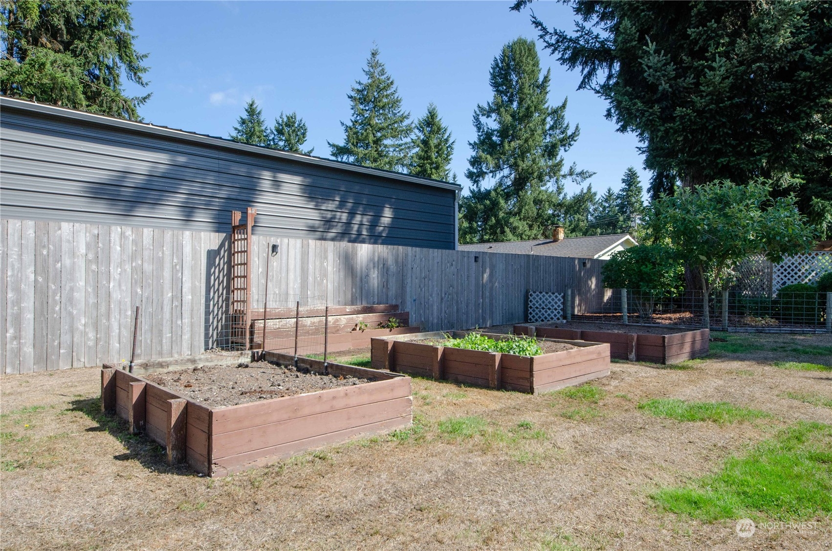 18425 Apricot Street Southwest Rochester, WA 98579 - Photo 24 of 39 a view of patio with a table and chairs