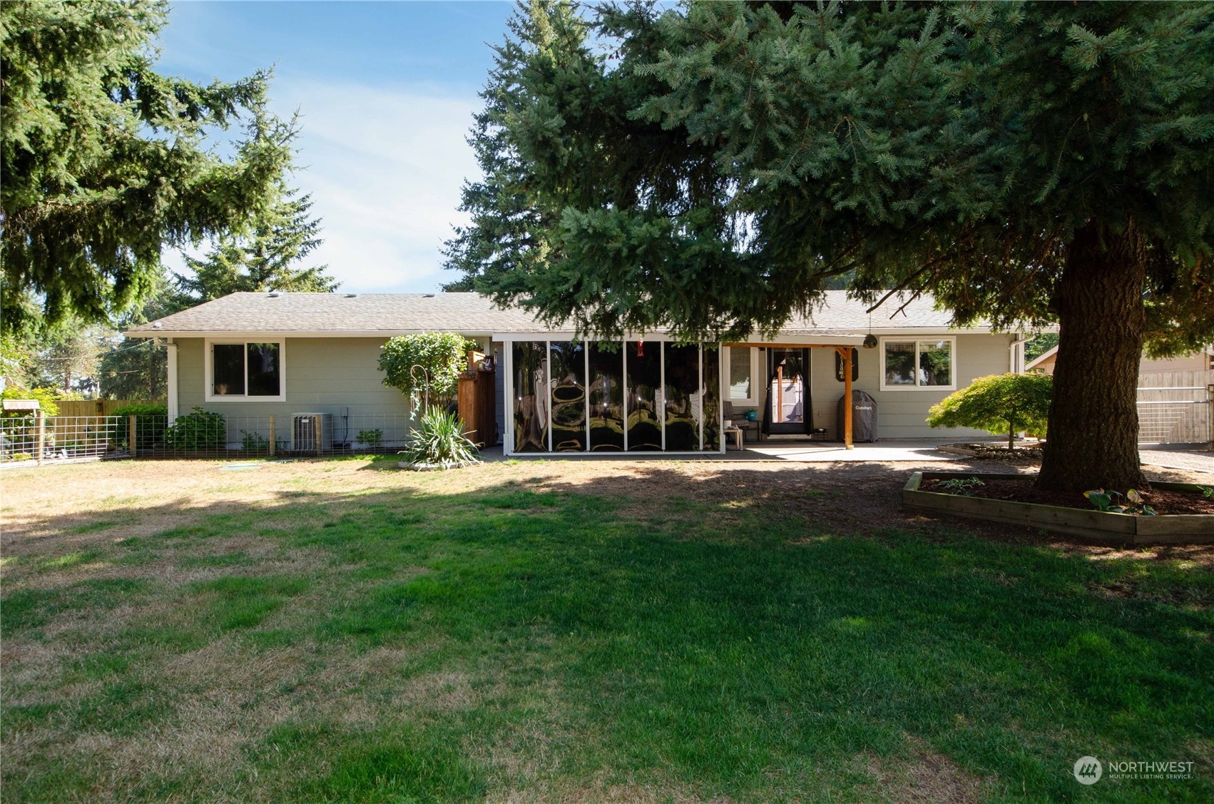 18425 Apricot Street Southwest Rochester, WA 98579 - Photo 25 of 39 a view of house with a yard