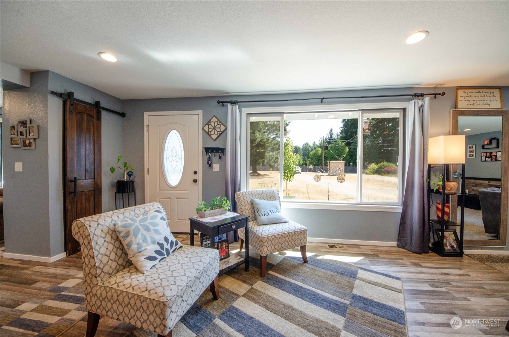 18425 Apricot Street Southwest Rochester, WA 98579 - Photo 6 of 39 a living room with furniture and a large window