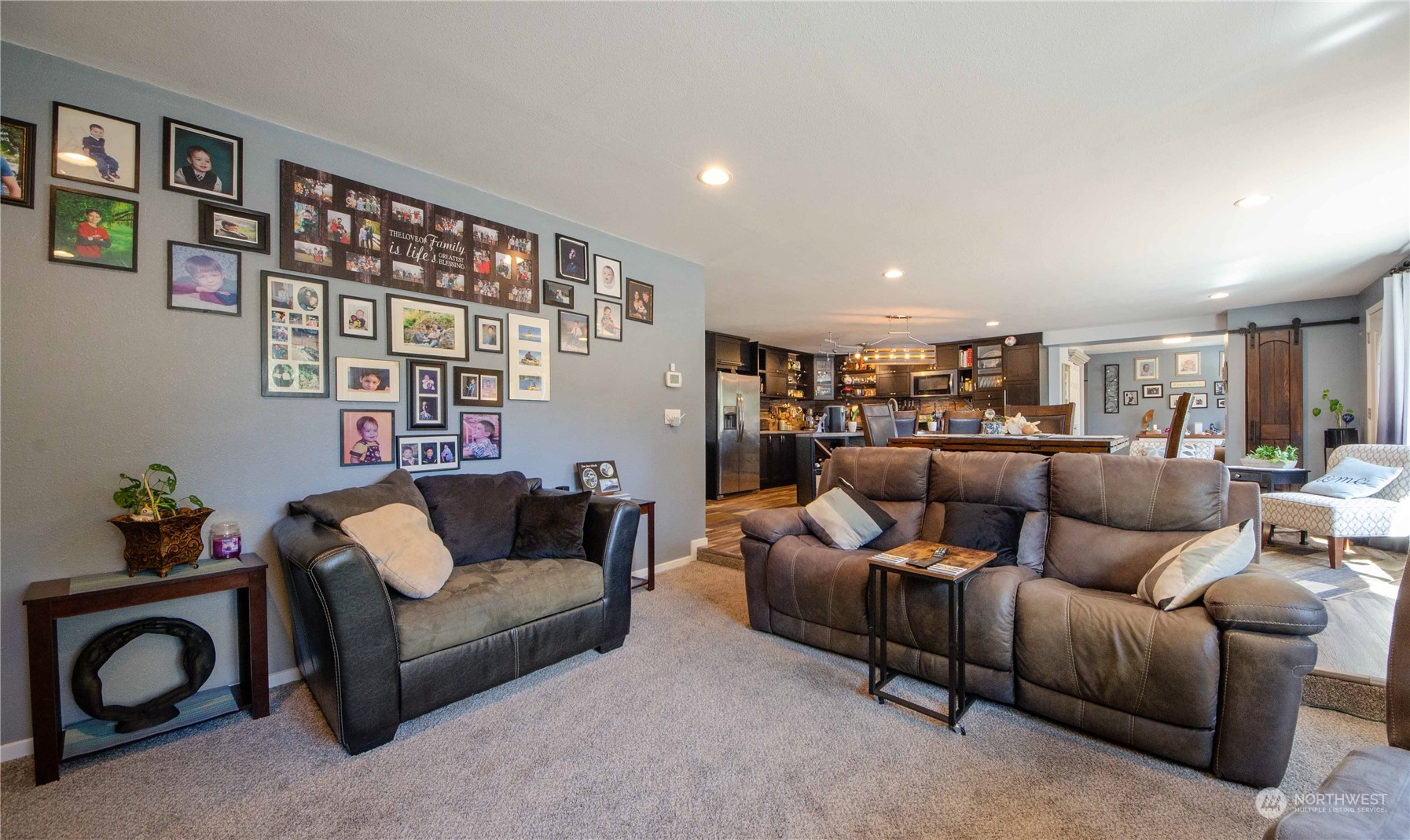 18425 Apricot Street Southwest Rochester, WA 98579 - Photo 8 of 39 a living room with furniture and a book shelf