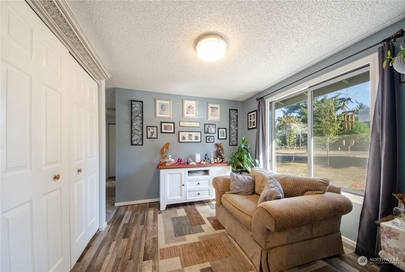 18425 Apricot Street Southwest Rochester, WA 98579 - Photo 9 of 39 a living room with furniture and a window