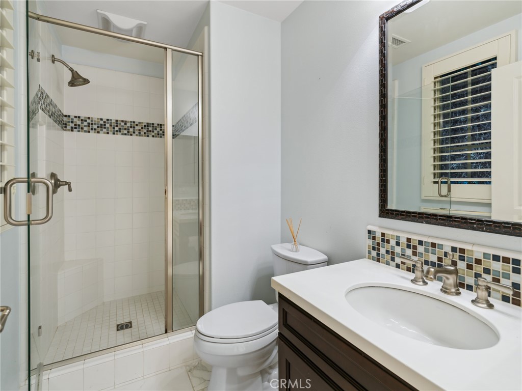 58 Lupari Irvine, CA 92618 - Photo 16 of 60 a bathroom with a sink and a mirror