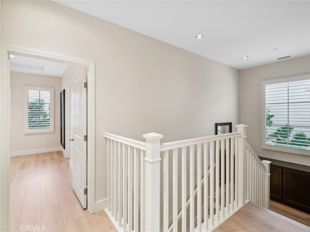 58 Lupari Irvine, CA 92618 - Photo 18 of 60 a view of a hallway with windows and stairs