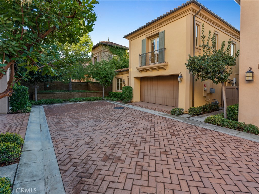 58 Lupari Irvine, CA 92618 - Photo 2 of 60 a front view of a house with a yard and trees
