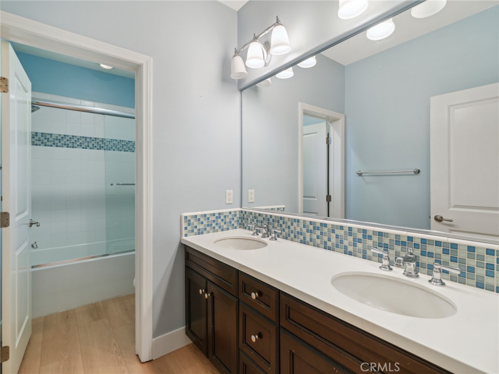 58 Lupari Irvine, CA 92618 - Photo 24 of 60 a bathroom with a sink a vanity and a mirror