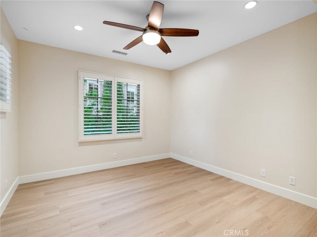 58 Lupari Irvine, CA 92618 - Photo 25 of 60 a view of empty room with wooden floor and fan