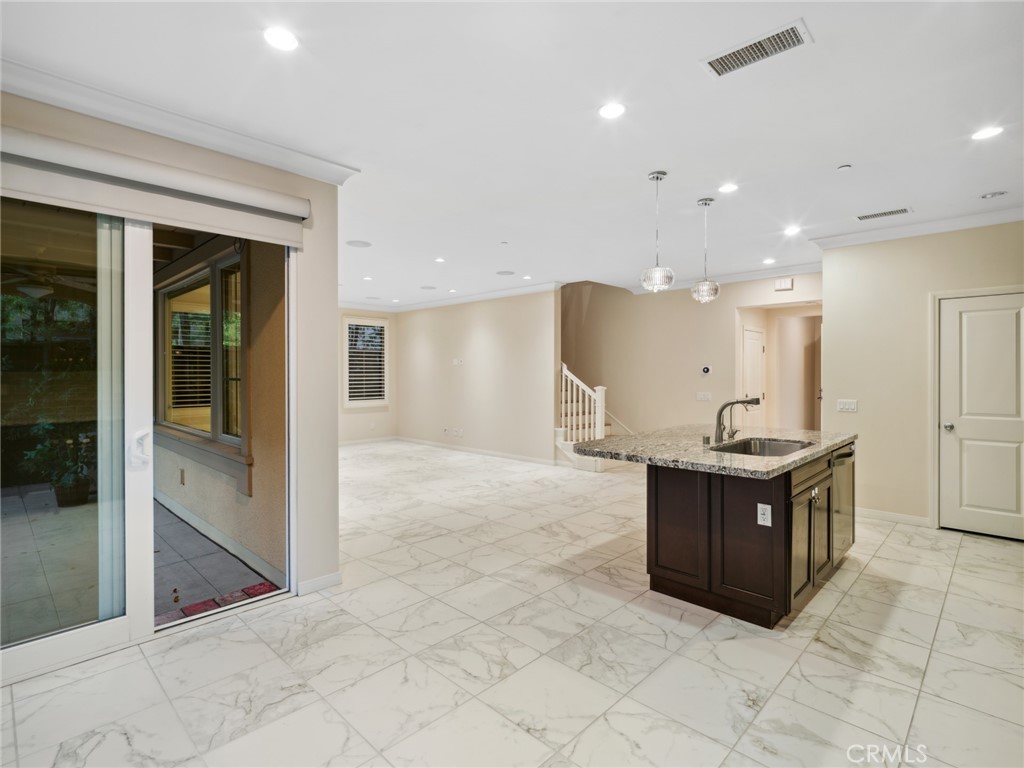 58 Lupari Irvine, CA 92618 - Photo 6 of 60 a large kitchen with stainless steel appliances granite countertop a large counter top and a stove