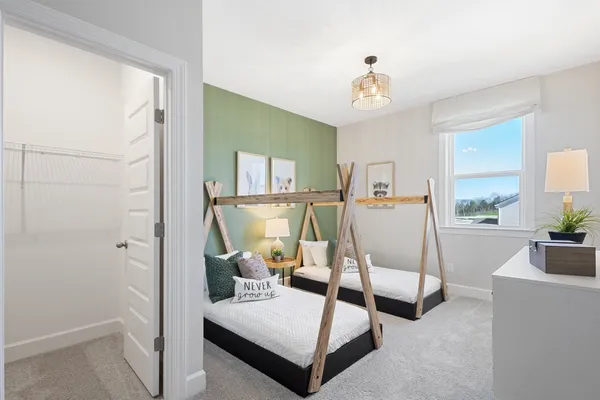 a bedroom with furniture and a chandelier