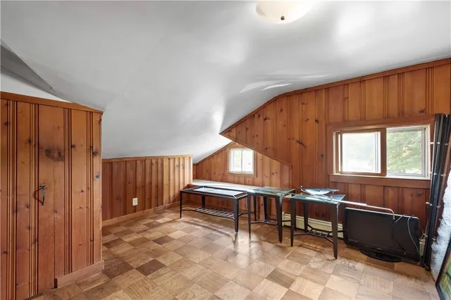 a view of a livingroom with furniture and staircase
