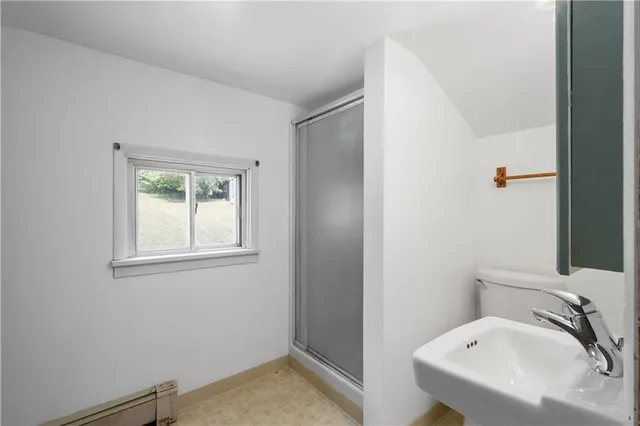 a view of hallway with stairs and furniture