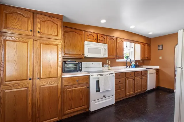 a kitchen with sink cabinets and stainless steel appliances